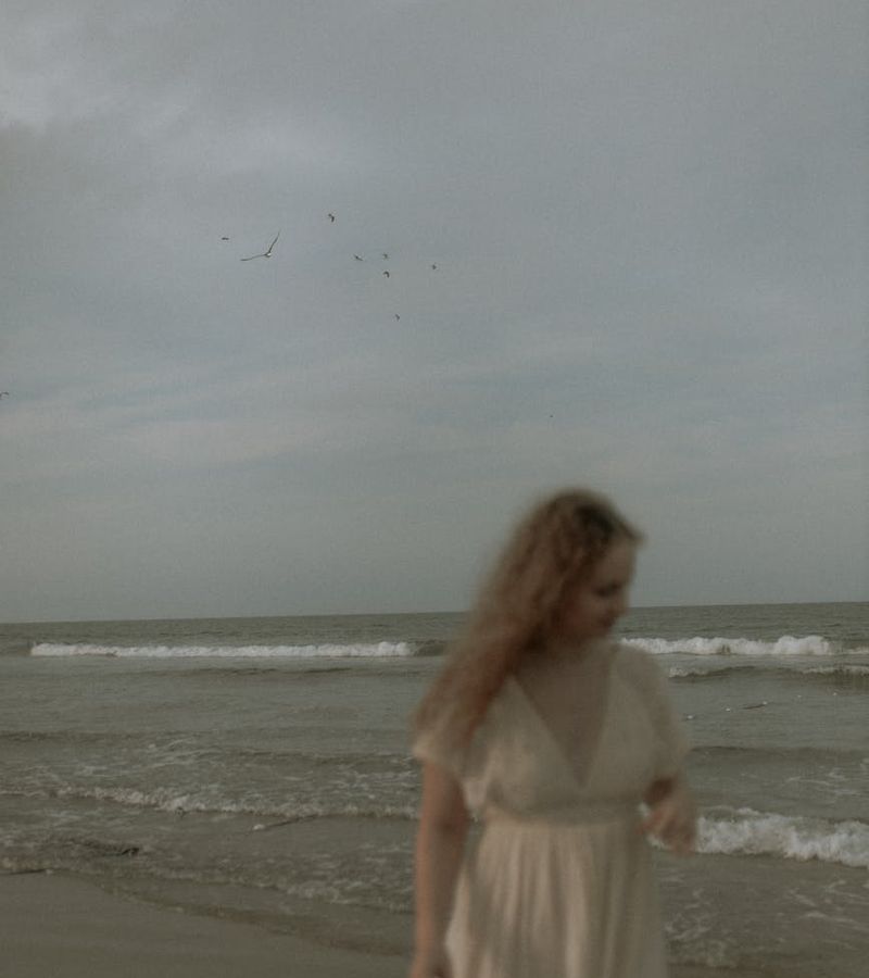 Woman performing a gentle evening stretch in a calm environment.